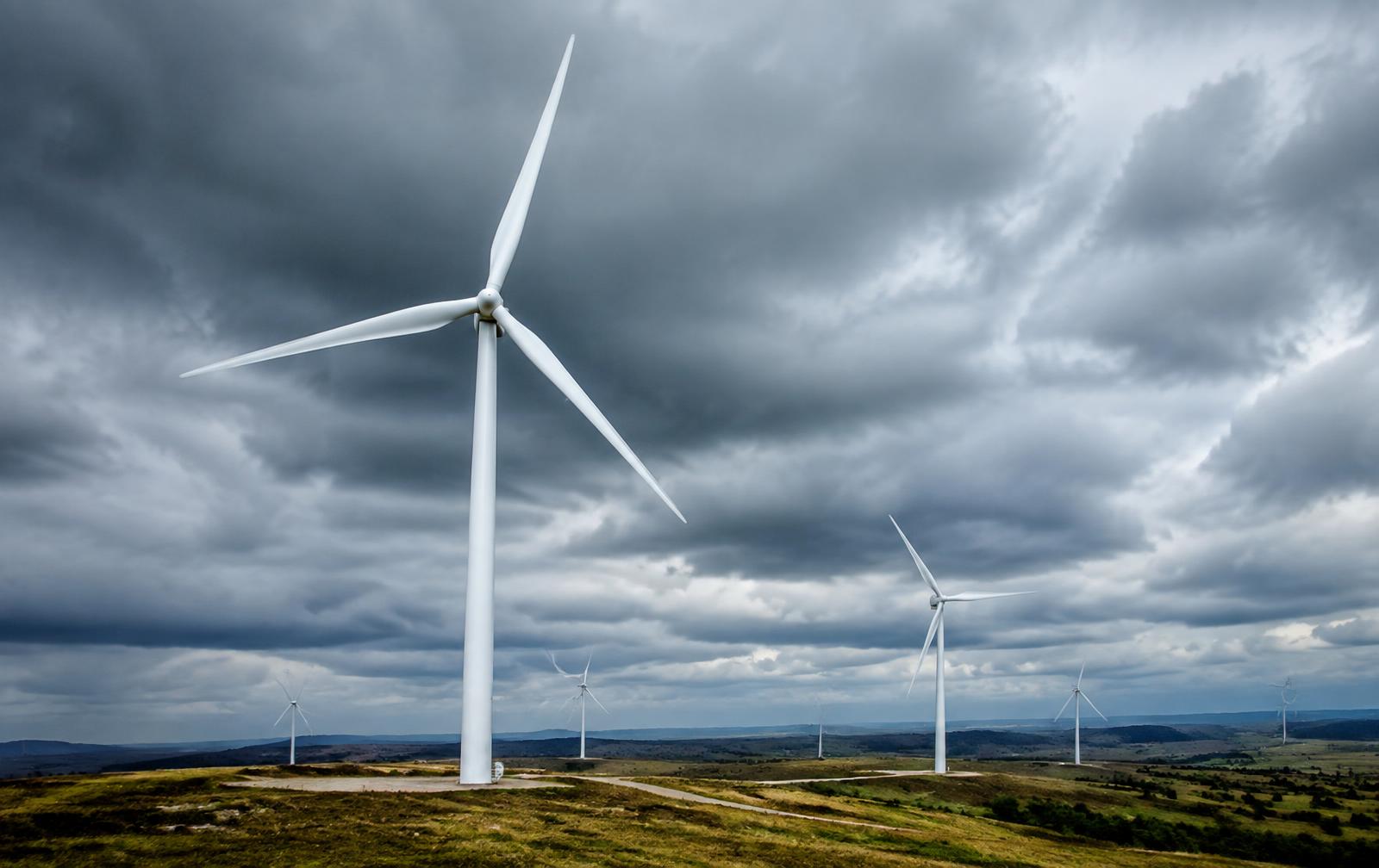 Onshore wind turbines under an overcast sky